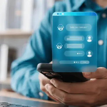 An employee interacting with a mobile chatbot app on a smartphone, demonstrating how Shadow AI usage leads to unauthorized generative AI data leakage from a corporate network.