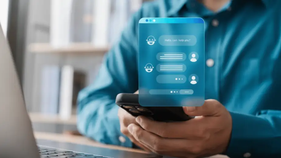 An employee interacting with a mobile chatbot app on a smartphone, demonstrating how Shadow AI usage leads to unauthorized generative AI data leakage from a corporate network.
